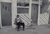 Man in Front of the Barber Shop by Cheryl  Miller